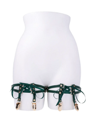 Indica garters displayed on mannequin torso, highlighting adjustable faux-leather straps and gold clips