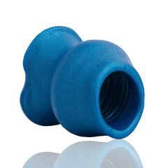 Interior ribbed tunnel of the Pig Hole Morph hollow plug shown from opening angle, blue silicone