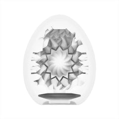 Interior view of Tenga Egg Shiny II showing stretchy white elastomer with starburst texture pattern