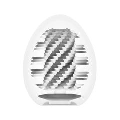 Internal spiral ribbed texture of the Tenga Egg Spiral shown through translucent white casing