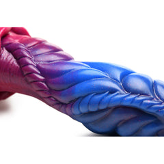 Close-up of Intruder alien dildo mid-shaft showing iridescent glitter finish and scale texture