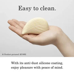 Iroha Kushi vibrator cradled in an open palm showing anti-dust silicone coating