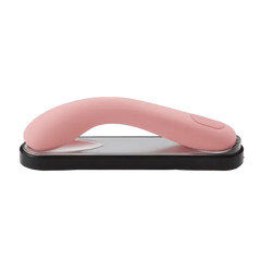 Iroha Mai Toki pink silicone vibrator resting curved-side-up on its sleek black charging tray