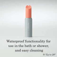 Iroha stick vibrator in coral pink shown on grey base, waterproof up to 20 inches