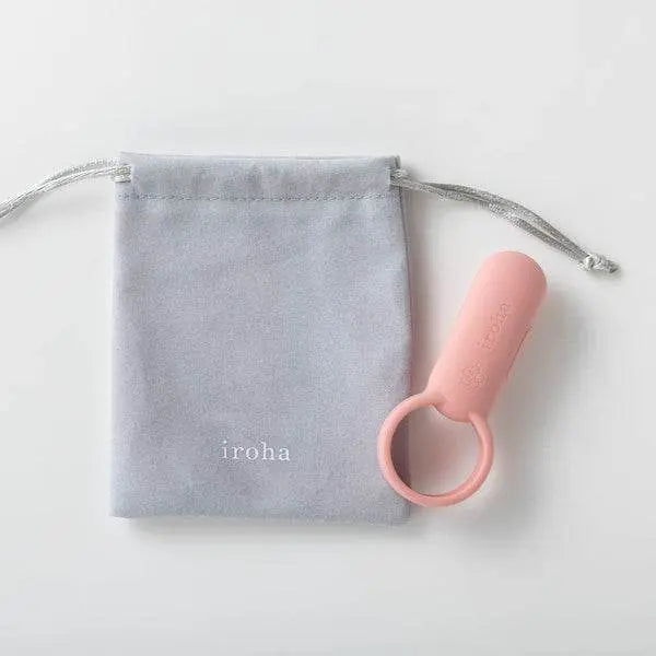 Iroha SVR pink vibrator beside its grey drawstring storage pouch, styled flat lay