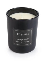 Je Joue massage candle in matte black glass jar scented with ylang-ylang and mandarin