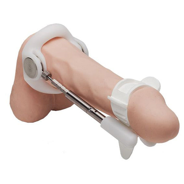 Jes-Extender Titanium penis extender device shown fitted on anatomical model, front view