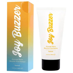 Joy Buzzer Naked Arousal Balm tube beside its colorful gradient box, 1.5 fl oz size shown