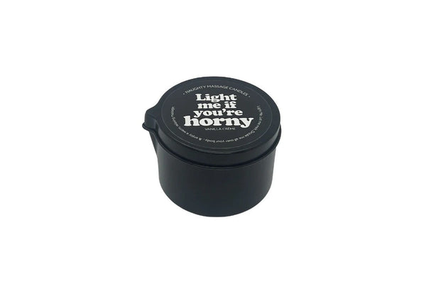Kama Sutra Light Me If You're Horny massage candle in a matte black tin with lid