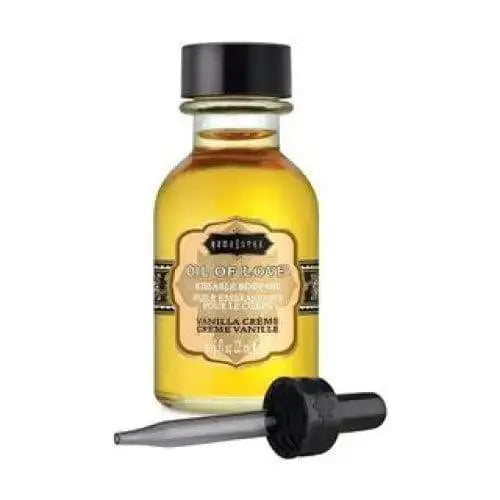 Kama Sutra Oil of Love Vanilla Crème in a small amber glass bottle with dropper