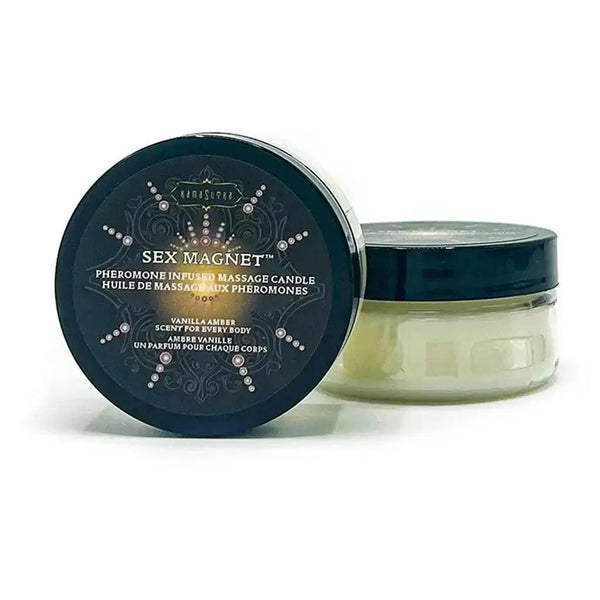 Kama Sutra Sex Magnet pheromone massage candle in a dark-lidded glass jar, vanilla amber scent