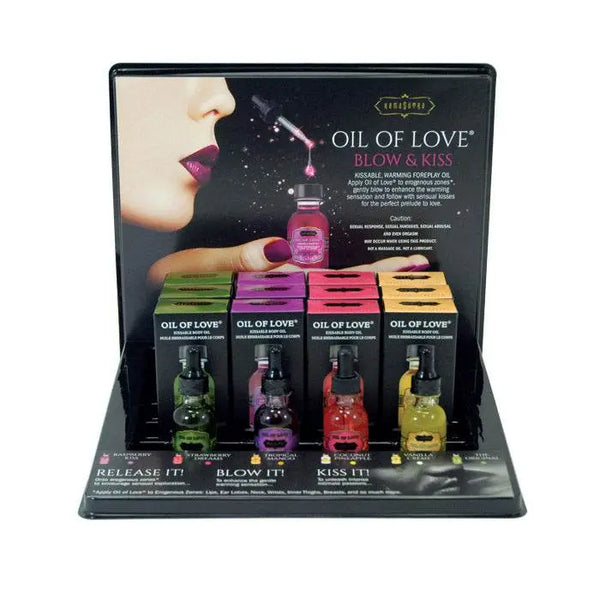 Kama Sutra Oil of Love retail display with twelve warming body oil bottles in assorted flavors