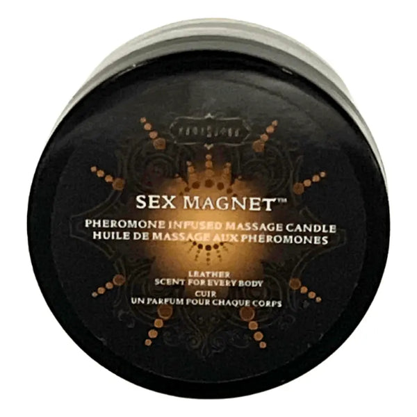 Kama Sutra Sex Magnet pheromone-infused massage candle in a round black tin, leather scent