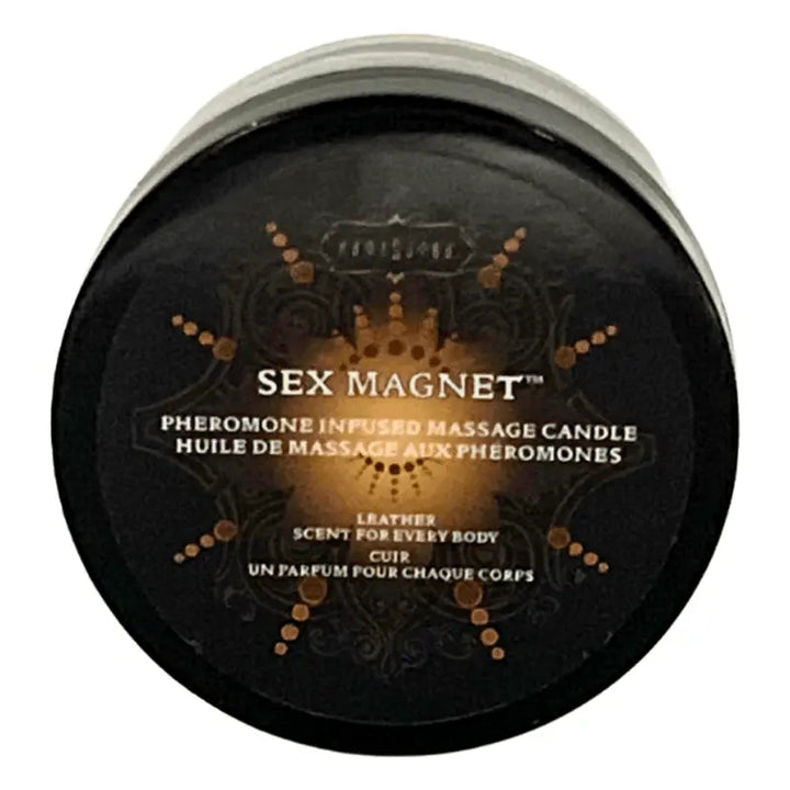 Kama Sutra Sex Magnet pheromone-infused massage candle in a round black tin, leather scent