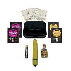 Kama Sutra Weekender Kit contents laid flat: olive bullet vibrator, oils, lubricant sachets, position cards