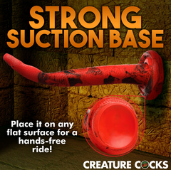 King Cobra suction base pressed to flat surface demonstrating hands-free stability for the silicone dong