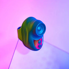 Close-up of Kisscool teal finger vibrator with tapping head and two control buttons