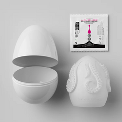Kraken egg case open beside the silicone sleeve and included water-based lubricant sachet