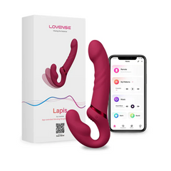 Lapis strapless dildo beside box and smartphone showing Lovense app interface
