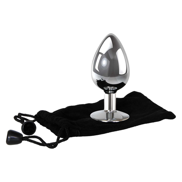 Large metal anal plug shown beside black velvet storage pouch, angled side view