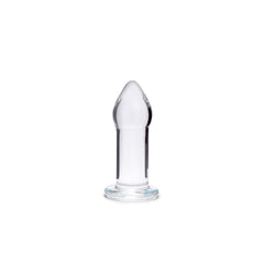 Larger clear glass anal plug upright, highlighting smooth tapered body and stepped base