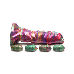 Larva Ovipositor Dildo on its side with four green silicone eggs displayed below shaft