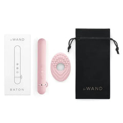 Le Wand Baton full contents laid flat: vibrator, textured ring, manual, storage pouch