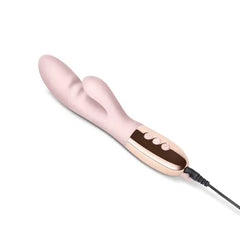 Le Wand Blend rabbit vibrator lying flat with USB magnetic charging cable attached