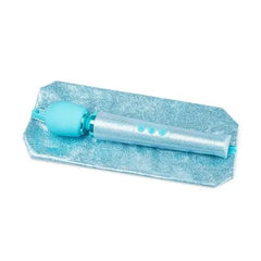 Le Wand blue glitter wand massager resting on matching sparkle storage pouch