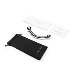 Le Wand Bow dildo displayed with black storage pouch and two informational cards from packaging