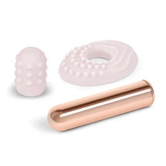 Le Wand Bullet with two interchangeable silicone accessories laid flat separately