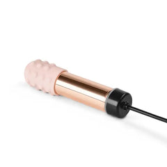 Le Wand Bullet vibrator connected to magnetic USB charging cable at base