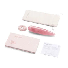Le Wand Crystal Wand flat lay showing wand, finger ring, storage pouch, guidebook and care card