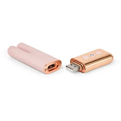 Le Wand Deux separated into two pieces revealing magnetic USB charging port on rose gold handle