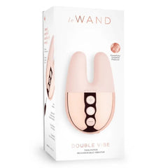 Le Wand Double Vibe retail packaging showing twin-motor rechargeable vibrator in blush pink
