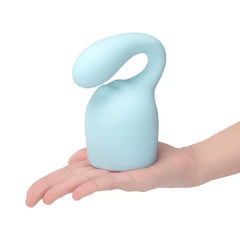 Le Wand Glider light blue silicone attachment resting on an open palm, size reference
