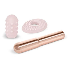 Le Wand Grand Bullet disassembled showing bullet, dotted sleeve, and flat textured silicone ring