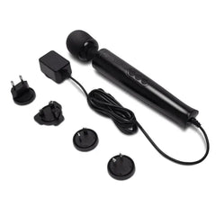 Le Wand massager displayed with four interchangeable international plug adapters