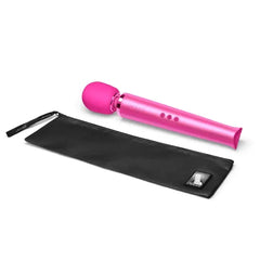 Le Wand massager in magenta beside its branded black satin storage pouch