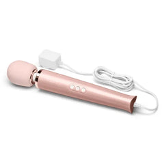 Le Wand massager with white power cord and compact wall adapter plugged in and ready for use