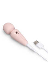 Le Wand Microwand connected to white USB charging cable showing magnetic charge port