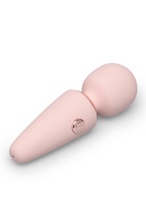 Close-up of Le Wand Microwand handle showing rose gold power button and soft-touch silicone finish