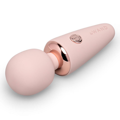 Le Wand Microwand pocket massager lying on side showing flexible ball head and rose gold collar