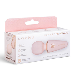 Le Wand Mini Vibe Microwand in blush pink with rose gold accents shown in retail box