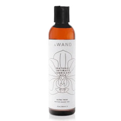Le Wand Natural Intimate Lubricant 8 oz amber bottle with black flip cap and floral label