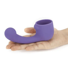Le Wand Petite Curve silicone attachment resting in open palm, showing compact size