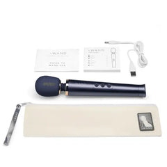 Le Wand Petite full kit laid flat: massager, travel pouch, USB cable, and user guides