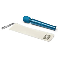 Le Wand Petite Massager beside its cream fabric storage pouch with branded zipper pull