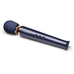 Le Wand Petite navy and gold wand massager shown at a slight upward angle, three-button panel visible