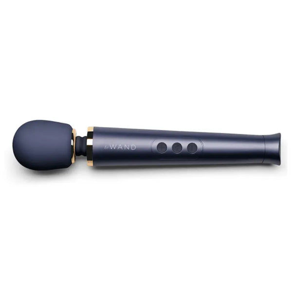 Le Wand Petite Rechargeable Massager in navy blue with gold collar accent, angled side view
